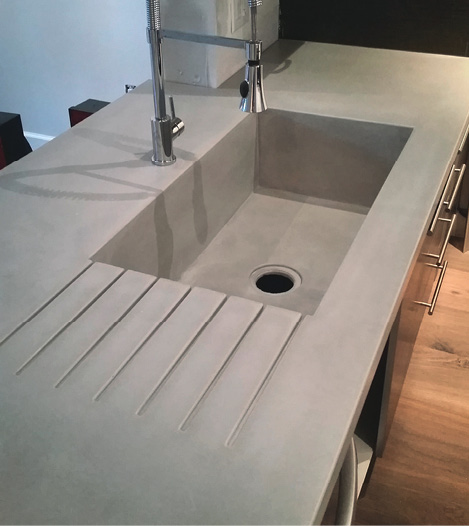 Seamless kitchen countertop with integral sink and drain board GFRC.