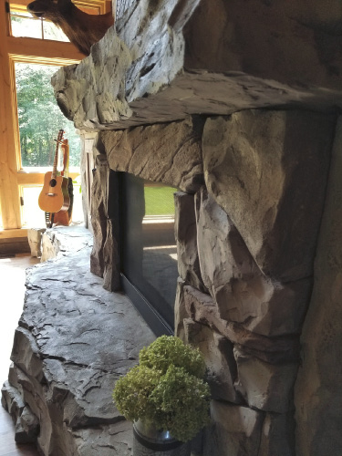 hearth measuring 21 feet long and a mantle 18  both resembling solid pieces of stone 