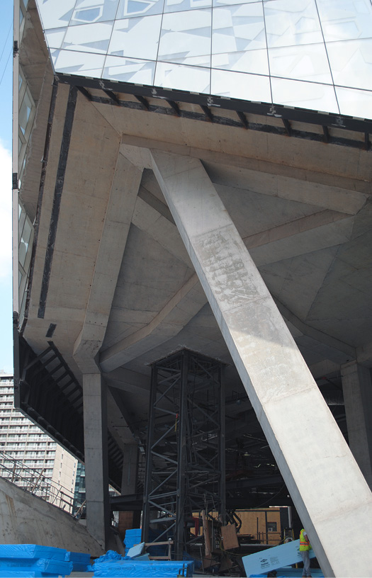 The structural concrete provides more than structural integrity. Designers didnt cover the columns and beams. The exposed concrete provided a background for additional decorative features.