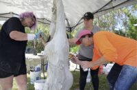 Cindee Lundin and attendees of the Concrete Decor Show 2017 working on an art installation at Innisbrook Resort
