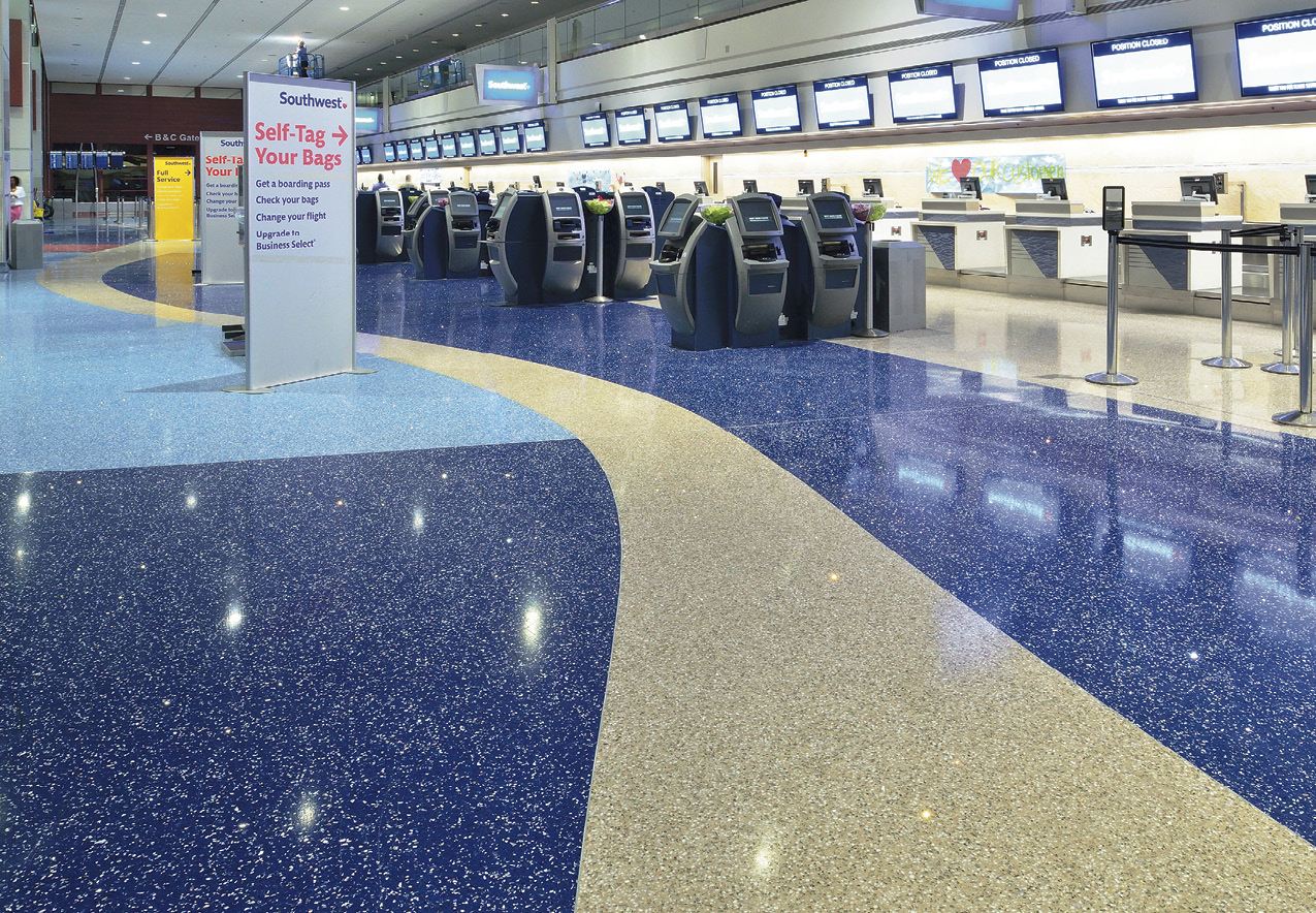 welcometo- Vegas imagery built on the concrete floor with the super-durable, venerable phenomenon known as terrazzo  the poured-in-place or precast mix of cement or epoxy combined with chips of marble, quartz, granite, glass, or other durable and decorative materials.