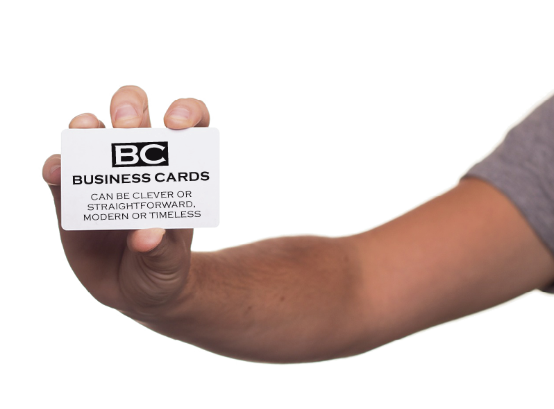A hand holding a business card "BC" Business cards. Can be clever or straightforward modern or timeless.