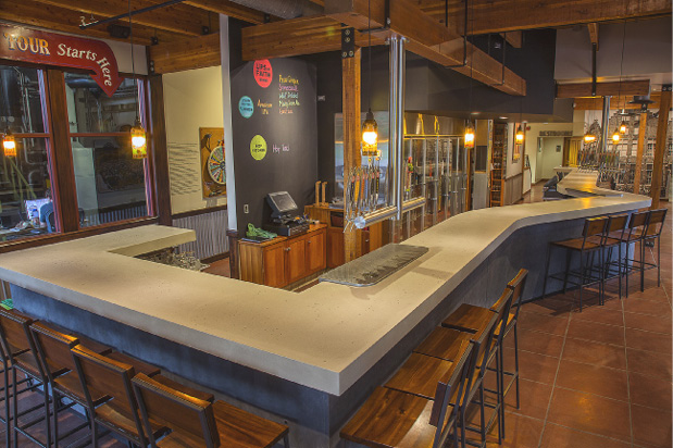 Bar and grill featuring concrete countertops.
