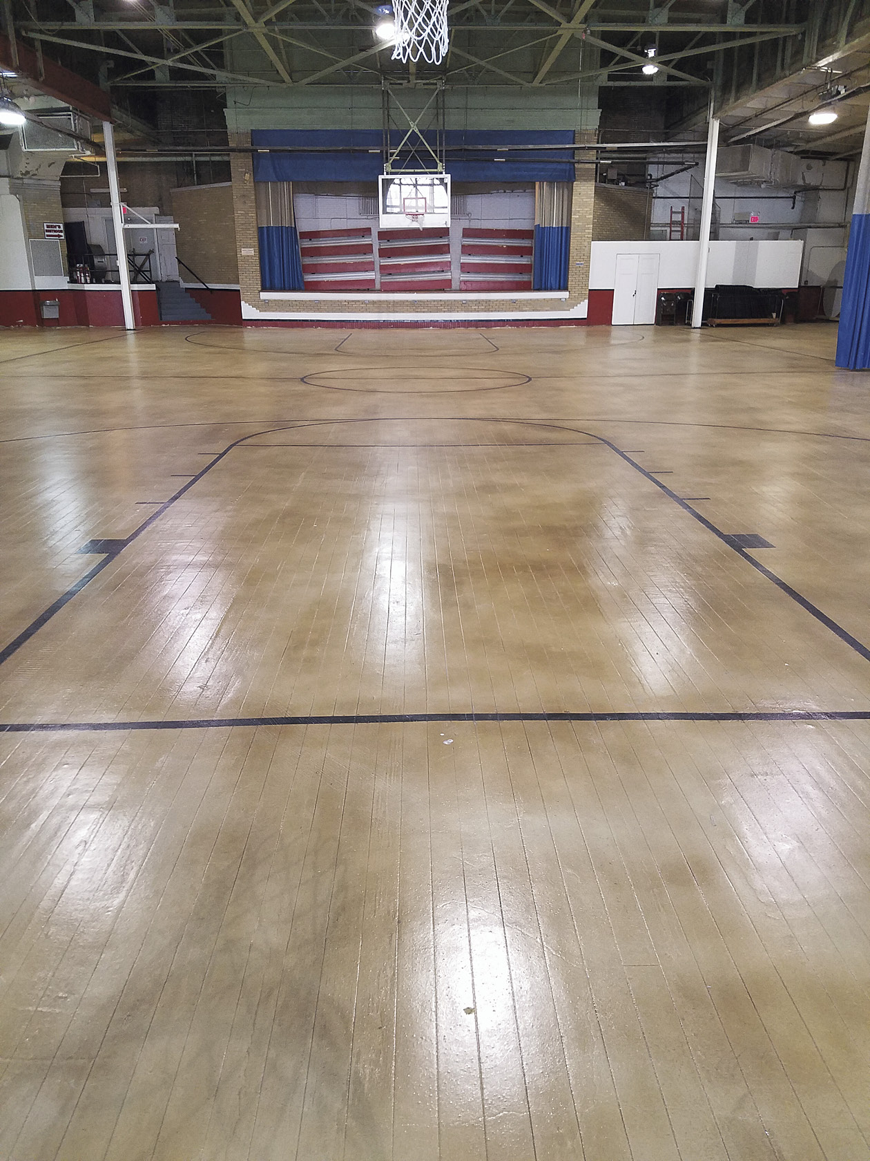 So it was quite a swoosh in his hoop when Bell landed the contract to resurface the 10,000-square-foot floor of the old gym, which had been acquired by the town from the YMCA and was now the Henry Township Community Center.