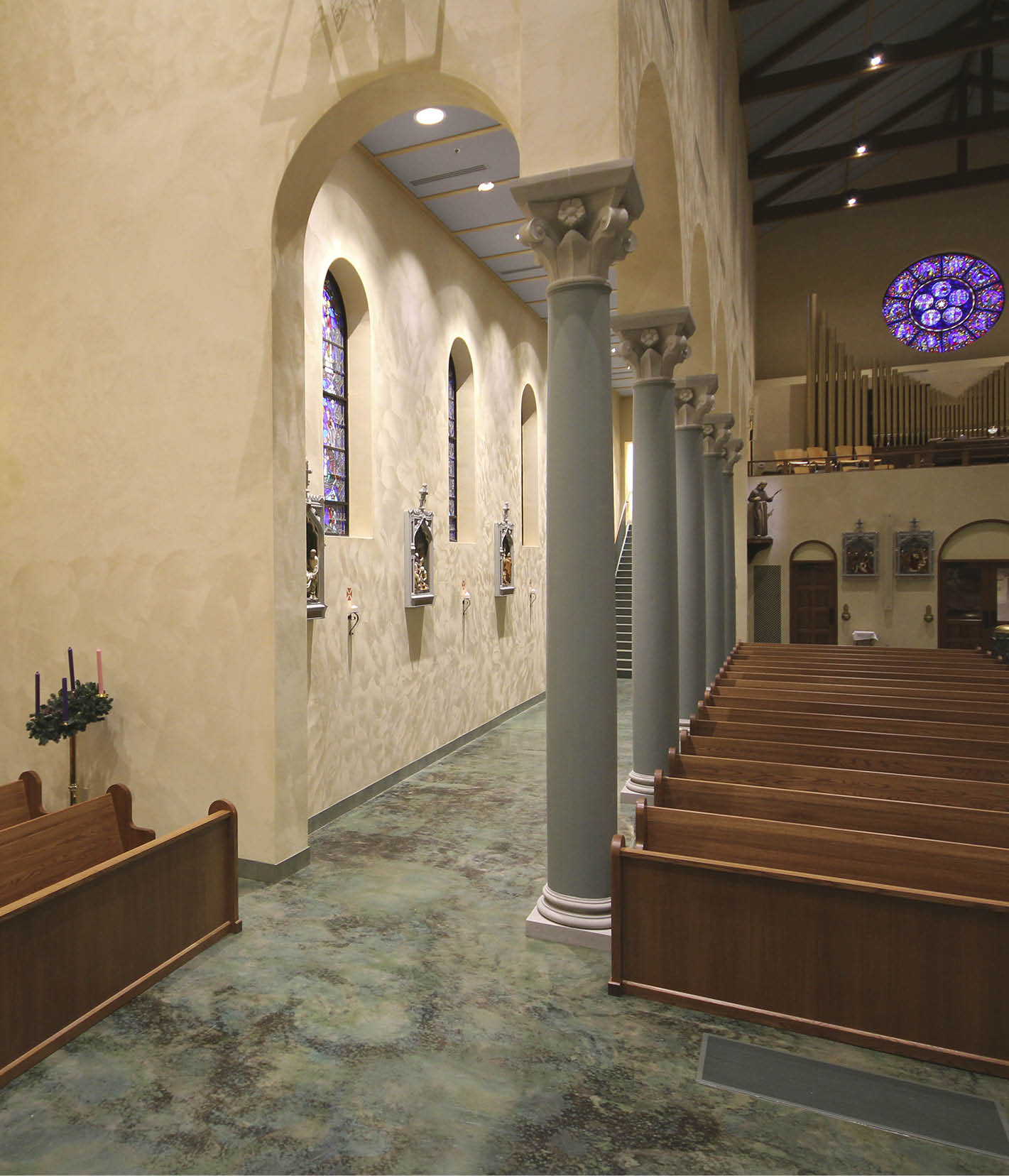 CarolinaCommanding attention on a hilltop in Greenville, South Carolina, the new Our Lady of the Rosary church is as impressive inside as it is outside with soaring arches, reclaimed glass windows and a beautiful marbleized stained concrete floor.