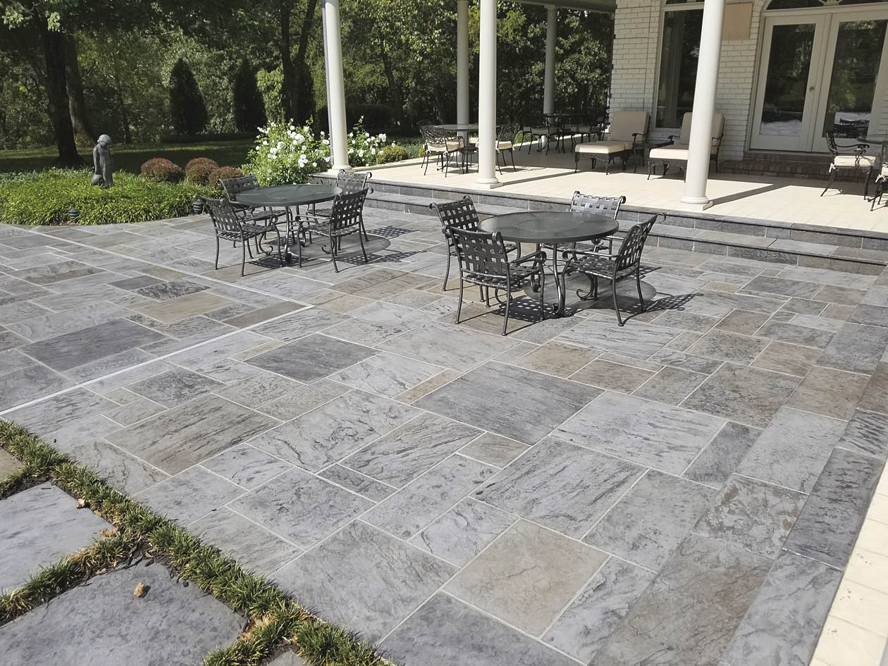 slate stamping pattern and colored the concrete with Scofield Lithochrome Color Hardener in Platinum Gray and with Lithochrome Antiquing Release.