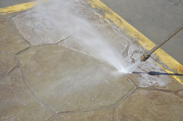 The last process to removing acrylic sealer from concrete is to pressure wash the concrete surface of any remaining sealer.
