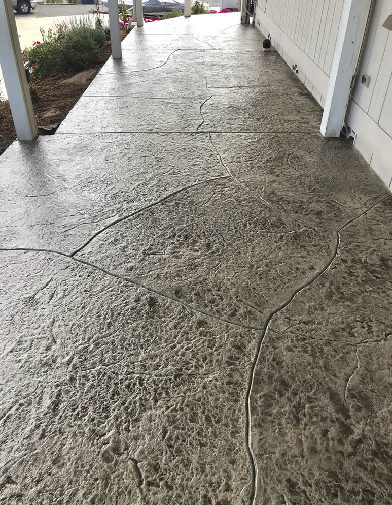 close up of hand carved stamped stone patio.