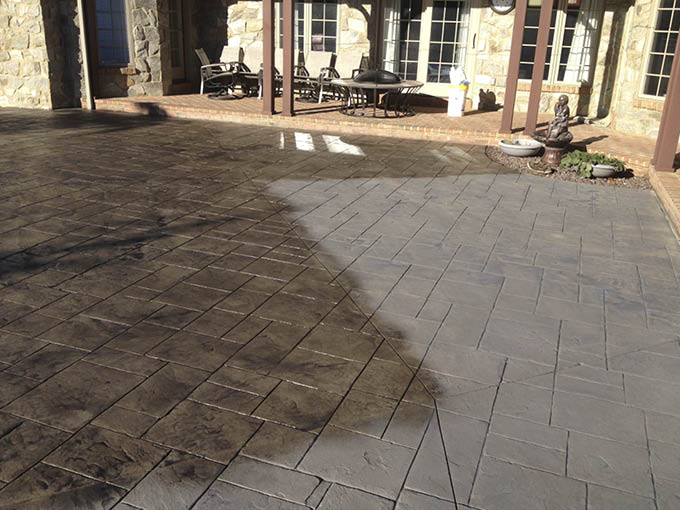 aesthetics can affect choosing the right concrete sealer , here is a patio that is being stained darker.