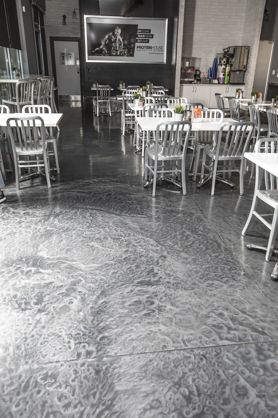 Two tone grey metallic epoxy floor system in a busy restaurant.