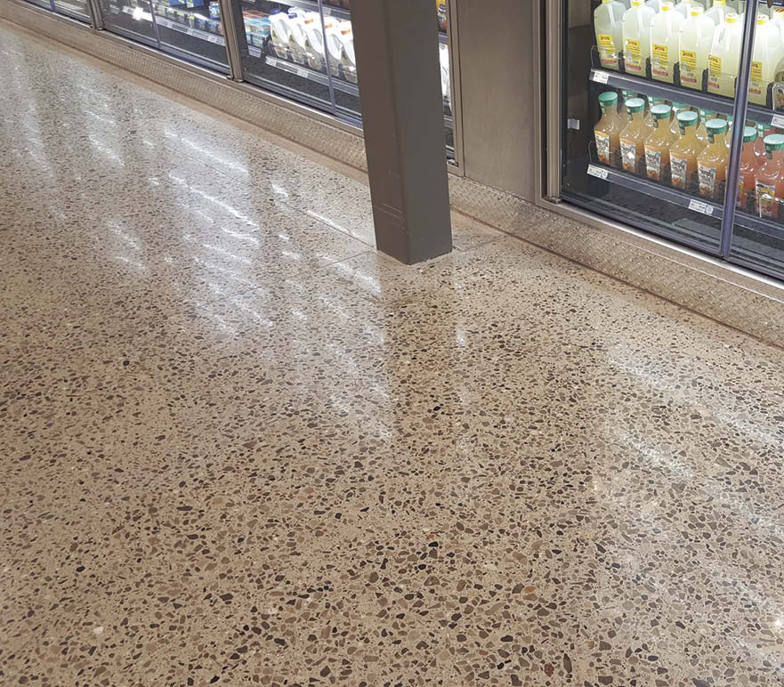 With the aid of KickStart, large aggregate in this grocery stores floor was exposed in only four steps. The products lubrication factor eliminated the heat and torque that pulls fines and aggregate from the floor which creates pinholes that then require a grout coat.