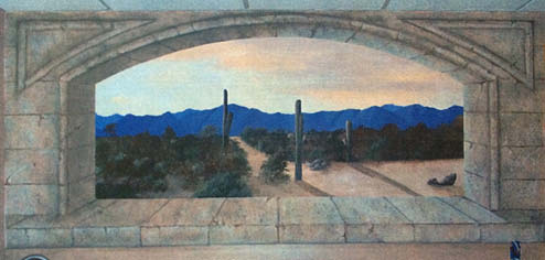 Concrete mural of a desert view.