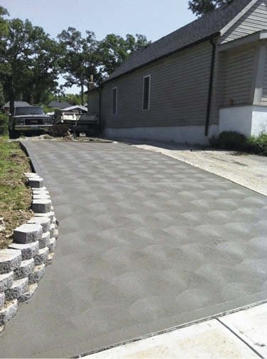 Broom finished concrete driveway.