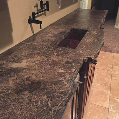 The class combined concrete made with Ashby Admix SR with stacked slate to make the water move and fall. In less than a weeks time, the sink went from concept to a working unit in his facilitys washroom.