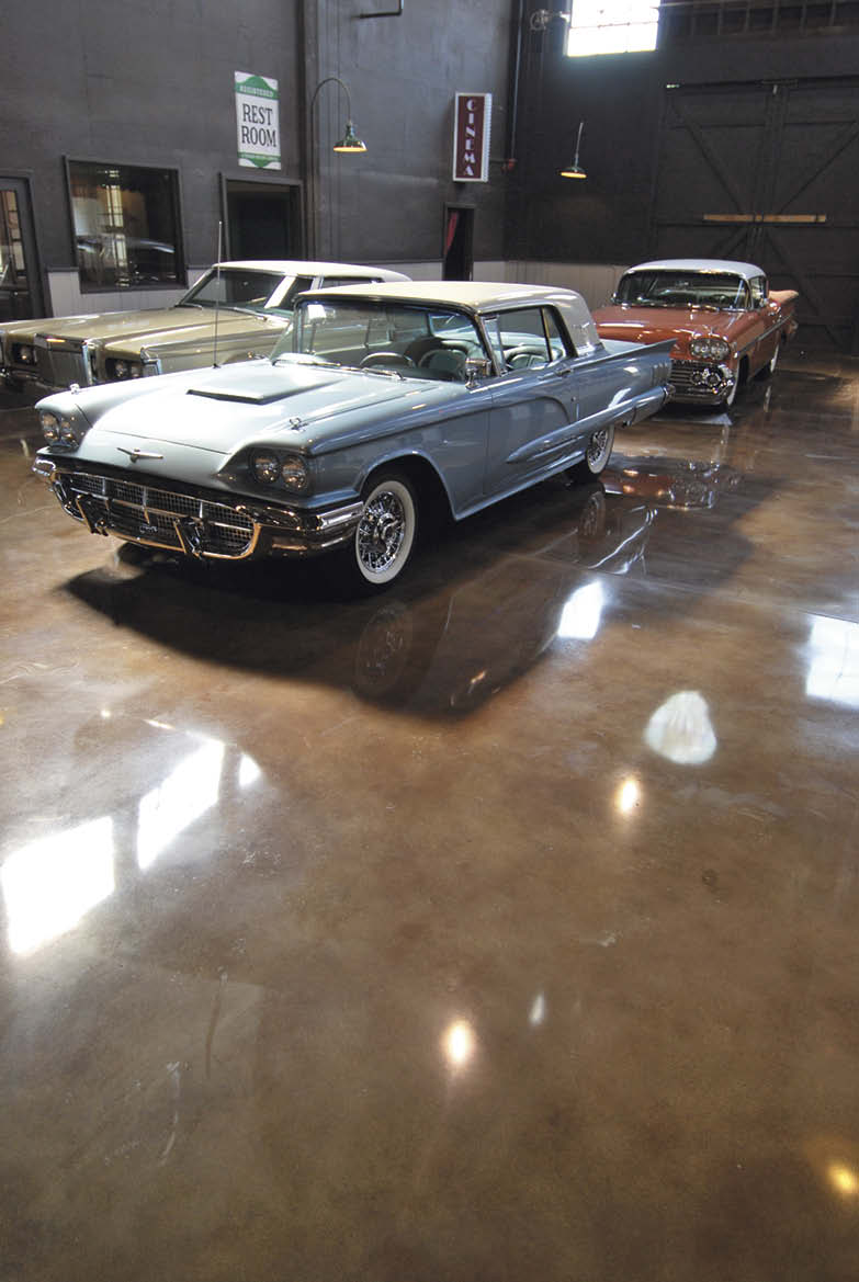 Vintage cars find their home on top of a beautifully polished floor.