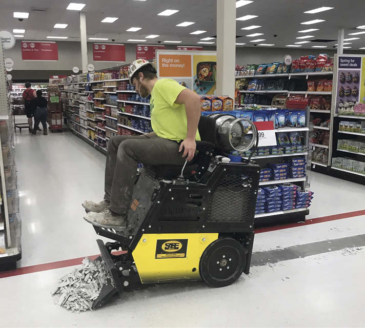 During a renovation on a big-box store that remains open for business, its typical for a demolition crew to work in one part of the store while polishing crews work in others.