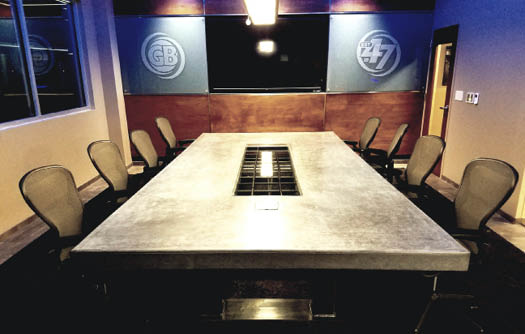 When the recession hit in 2008, Ortmann Concrete expanded its offerings to include concrete countertops, which it markets under the name Bellattex. Now the company is developing a table line, too. Seen here is an 18-by-6-foot conference room table it made for Goodwin Brothers Construction, a large Midwest general contractor whose work includes mass concrete placement.
