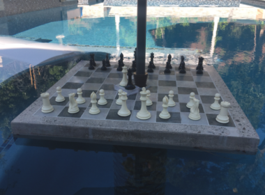 Concrete chess table in a swimming pool