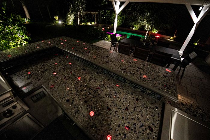 Glass aggregate and fiber optics in an outdoor kitchen