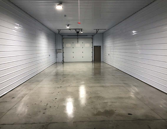 A large garage storage space that has sealed concrete in it.