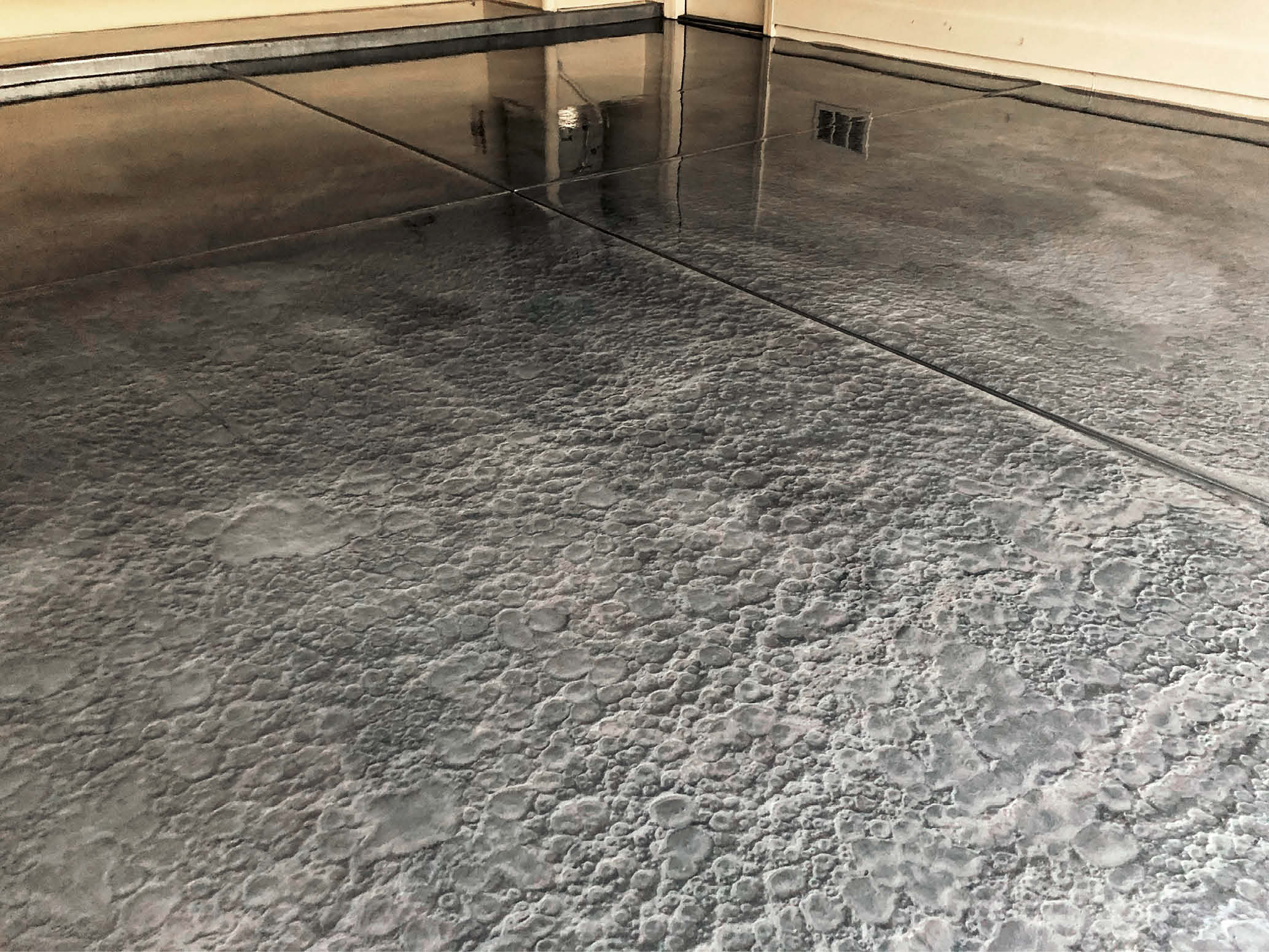 Dark floor with metallic epoxy affect to make it look like floating.