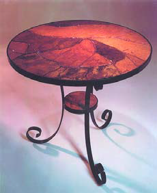Accent tables such as this red concrete table are striking in many spaces.