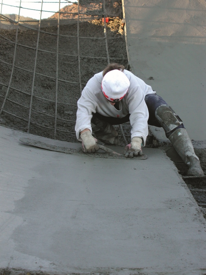Troweling concrete in the skatepark. This company builds only its own designs and designs only for parks that it will build. 