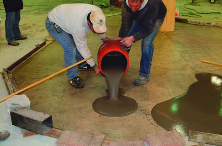 An overlay is applied to a properly prepared and primed concrete surface.