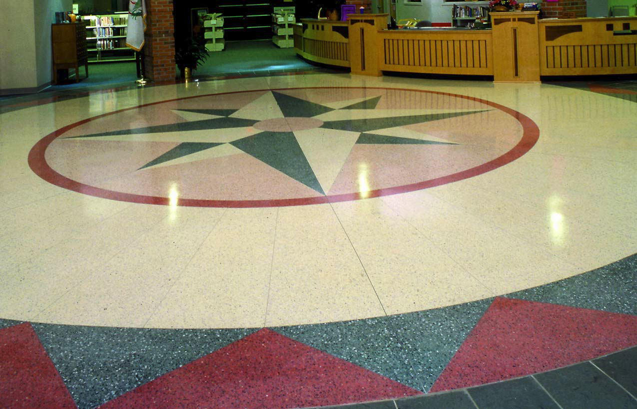 Another shot of an epoxy aggregate floor that is made to look like a compass rose.