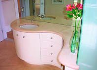 A bathroom vanity with concrete countertop
