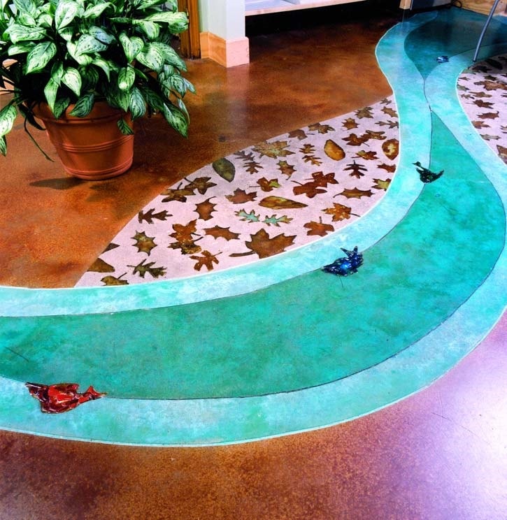 Stained concrete that looks like a stream with fish and two colors of blue green concrete stain for the water. One way to change the color of decorative concrete is to use a pigmented sealer. Pigmented sealers come in a variety of types such as water-based, solvent-based, and penetrating sealers. 