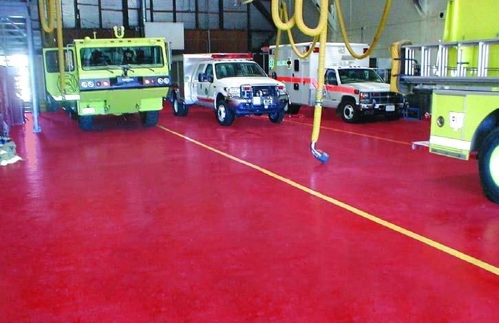 Fire engine red floor coating on a busy fire department garage floor.