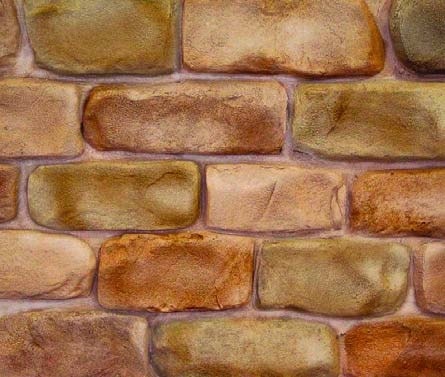 Softly sculpted brick made from a cementitious overlay on a dining room interior wall.