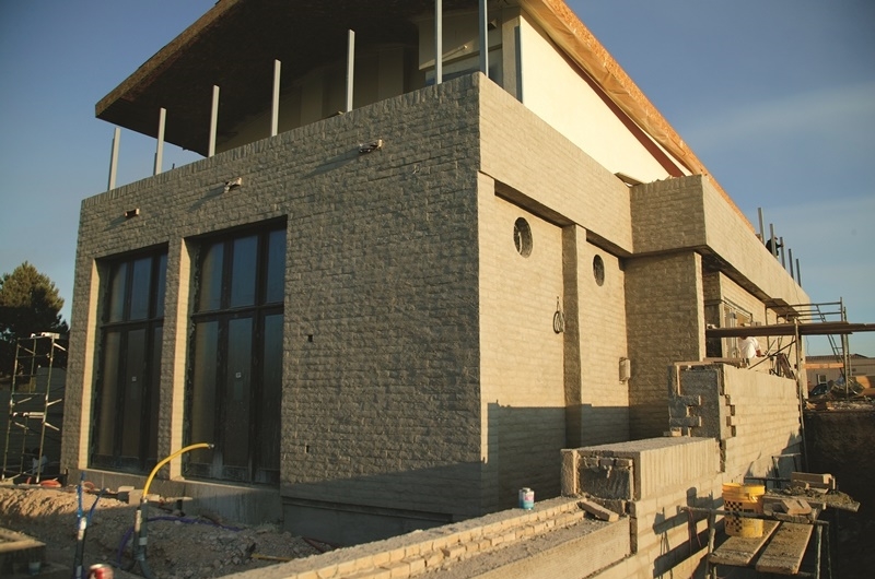 TNAHs exterior finish features decorative concrete masonry and stucco.