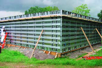 Concrete cast-in-place walls are created for this large building using removable forms.