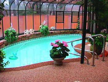 Backyard indoor pool with a updated pool deck 
