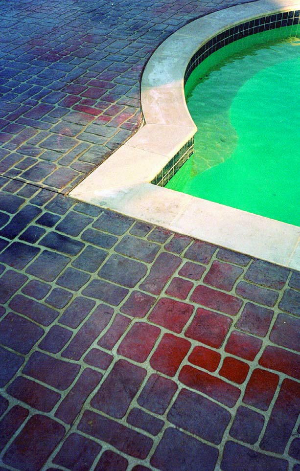 Concrete that has been stenciled on a pool deck. This technique requires some finesse, but the finished product is more than worth it.