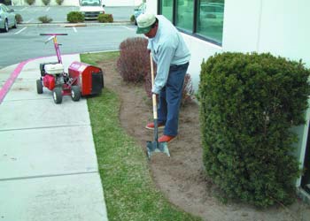 To prep a space for decorative concrete curbing, cut a trench that measures 2 inches by 9 inches, with a depth of 1 inch to 2 inches
