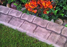 Concrete curbing creates a edge that looks like natural stone.
