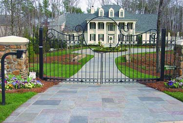 This dramatic driveway leading up to a large mansion has used color to create randomness and intrigue on the long driveway.