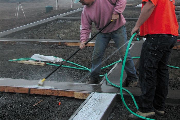 Applying Top Cast Chemical Surface Retarder on concrete and then washing it away with water