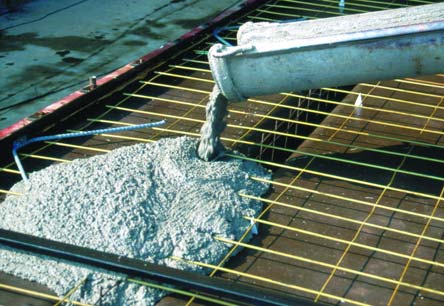 The main reason to add water to concrete  above and beyond what is needed for the proper hydration of the cement particles  is to improve workability, of course.