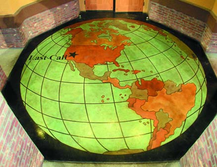 Large 3D globe with Last Call star stained in concrete