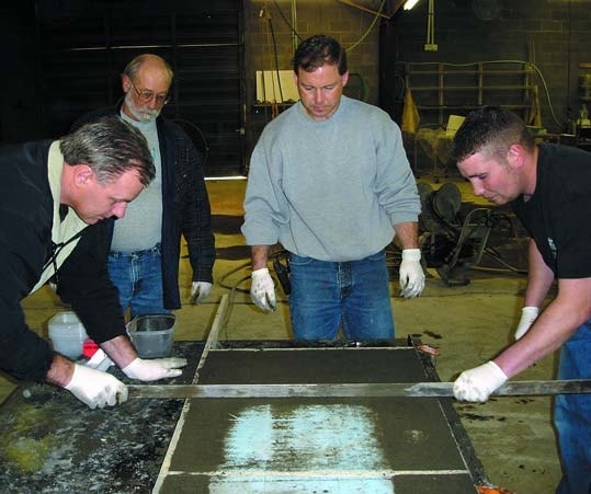 Students learning how to precast concrete countertops at the Concrete Countertop Institute.