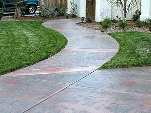 stamped curved walkway - The walkway makes a gentle curve toward the courtyard gate.