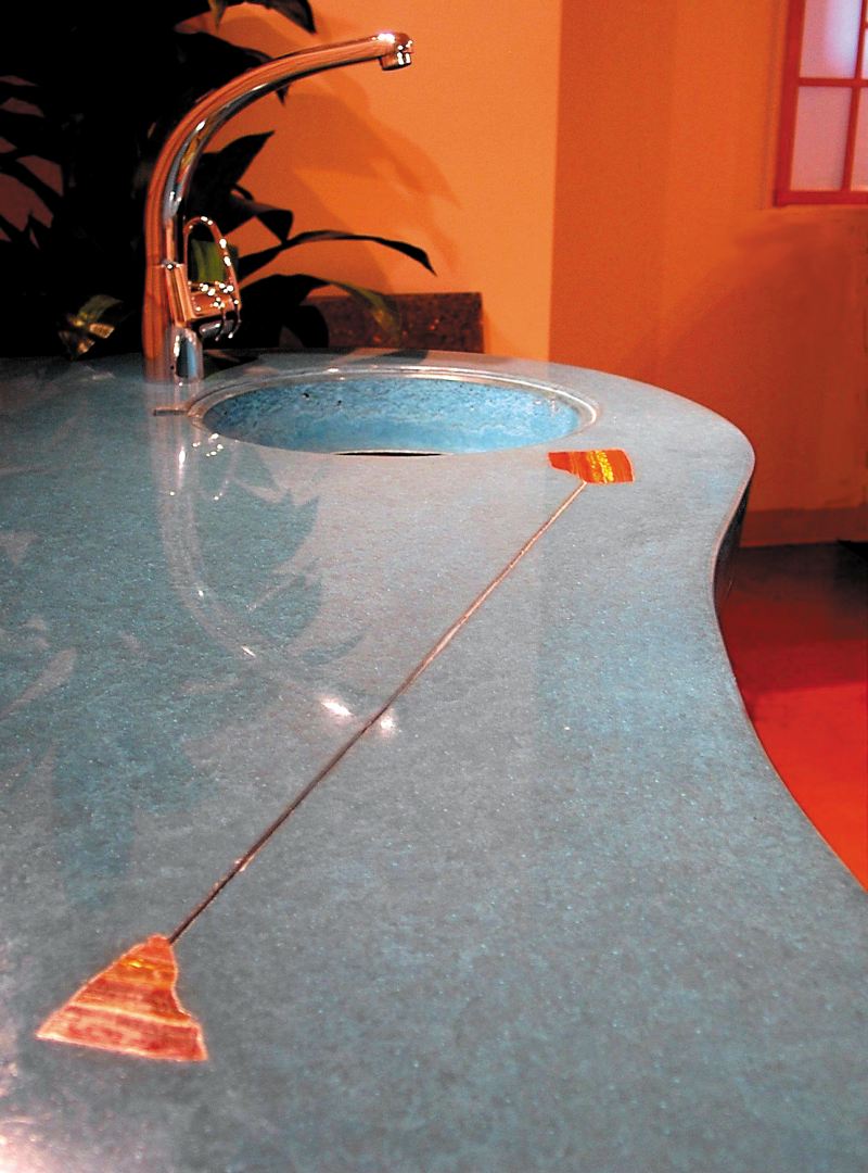Lokahi Stone - teal concrete countertop side bar with inset stone and metal with a integral sink.