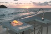 Outdoor concrete kitchen modeling on a beach in Hawaii during sunset.
