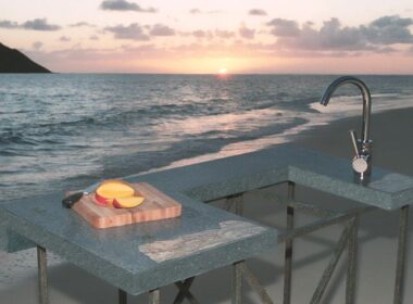 Outdoor concrete kitchen modeling on a beach in Hawaii during sunset.