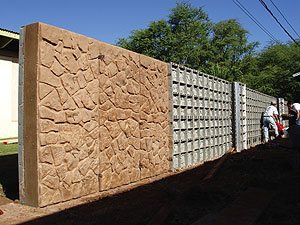 Arch-Crete calls its panels unitized, meaning they consist of an integrated structural grid with a textured face that was contoured using natural stones. The grid acts as reinforcement while the concrete is being poured.