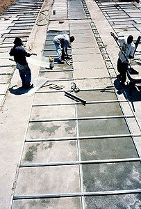 Concrete Countertop forms being laid out in a grid for a mass production of almost 500 concrete table tops in a short time frame.